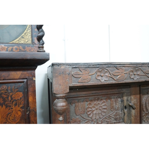 1011 - A 17th century carved oak court cupboard, dated 1685, width 170cm, depth 55cm, height 150cm