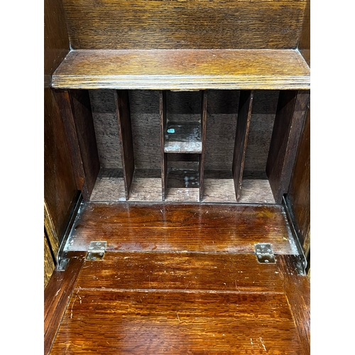 1012 - An early 20th century oak bureau bookcase, length 120cm, depth 28cm, height 154cm