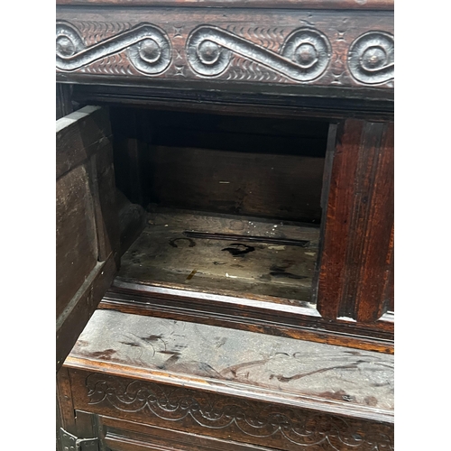 1015 - A 17th century oak court cupboard, width 139cm, depth 57cm, height 146cm