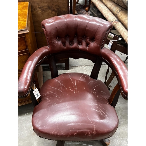 1026 - An early 20th century burgundy leather tub framed swivel desk chair, width 61cm, depth 50cm, height ... 