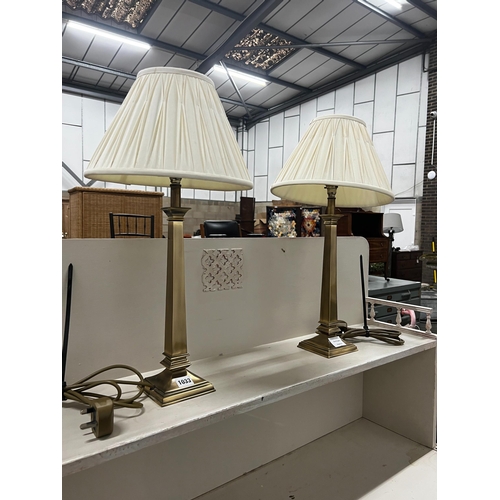 1033 - A pair of contemporary brass effect table lamps and shades, height including shades, 58cm