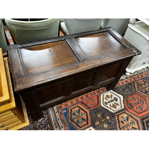 1064 - A late 17th / early 18th century panelled oak coffer, length 108cm, depth 48cm, height 66cm