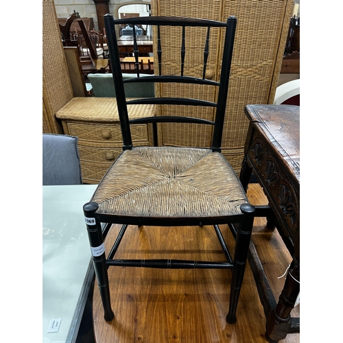 1069 - A 19th century ebonised beech rush seat Sussex style chair, width 41cm, height 83cm