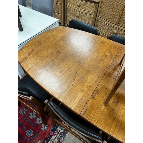 1071 - A mid century Novocraft teak dining suite comprising extending dining table 230cm extended, width 97... 