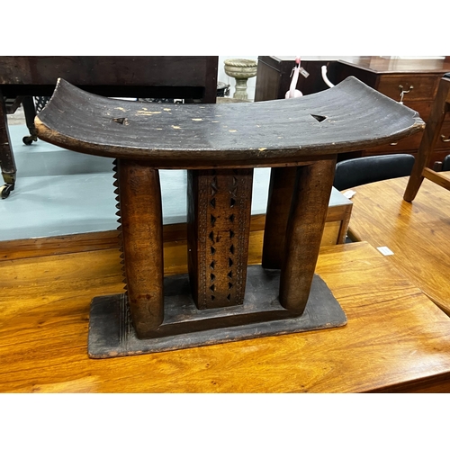 1079 - Two African chip carved stools, larger width 56cm, height 47cm