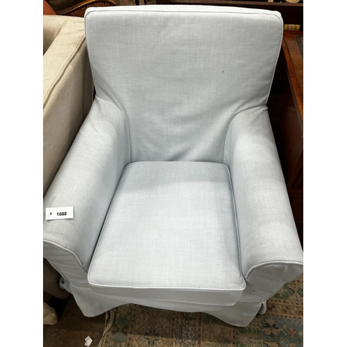 1088 - A Laura Ashley armchair upholstered in a pale blue fabric, length 76cm, depth 65cm, height 86cm... 