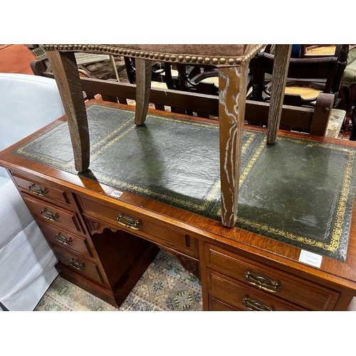 1089 - A late Victorian mahogany kneehole writing desk, width 122cm, depth 55cm, height 75cm together with ... 