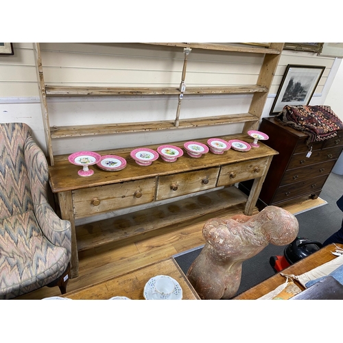 1102 - A large 19th century pale pine kitchen three drawer dresser, with open rack, length 214cm, depth 51c... 