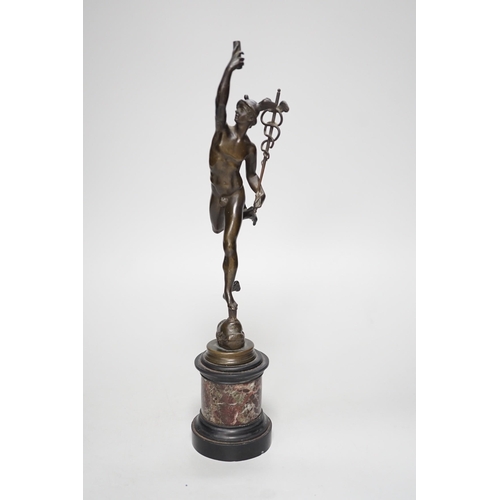 1250 - A bronze figure of Mercury on a graduated marble plinth. 33cm tall