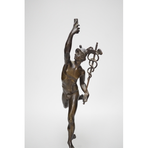 1250 - A bronze figure of Mercury on a graduated marble plinth. 33cm tall