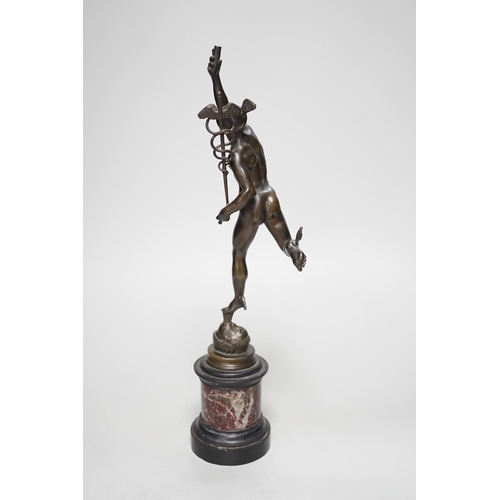 1250 - A bronze figure of Mercury on a graduated marble plinth. 33cm tall