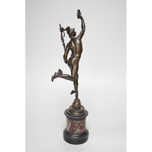 1250 - A bronze figure of Mercury on a graduated marble plinth. 33cm tall