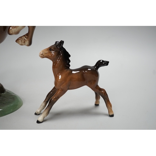 1255 - Two Beswick models of horses, one rearing and the other a foal. Tallest 27cm