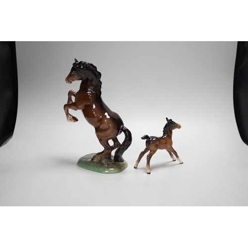 1255 - Two Beswick models of horses, one rearing and the other a foal. Tallest 27cm