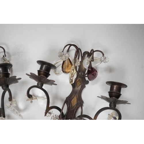 1279 - A pair of bronze or brass two branch wall sconces with cut glass drops,