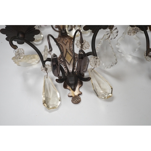 1279 - A pair of bronze or brass two branch wall sconces with cut glass drops,