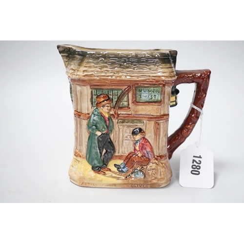 1280 - A Doulton Oliver Twist series ware jug and a Pelham puppet