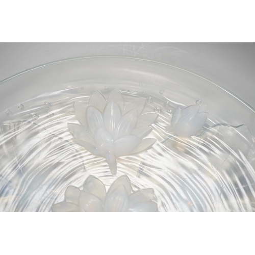 1284 - A Verlys opalescent glass dish with flower decoration. 35cm diameter