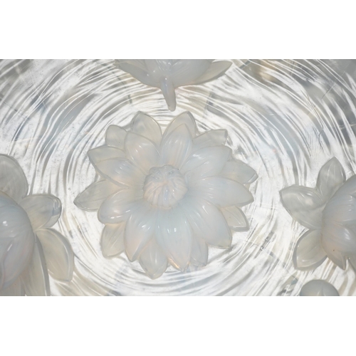 1284 - A Verlys opalescent glass dish with flower decoration. 35cm diameter