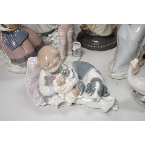 1302 - Seven Lladro and two Nao porcelain figures together with another, stuck to base so mark cant be see... 