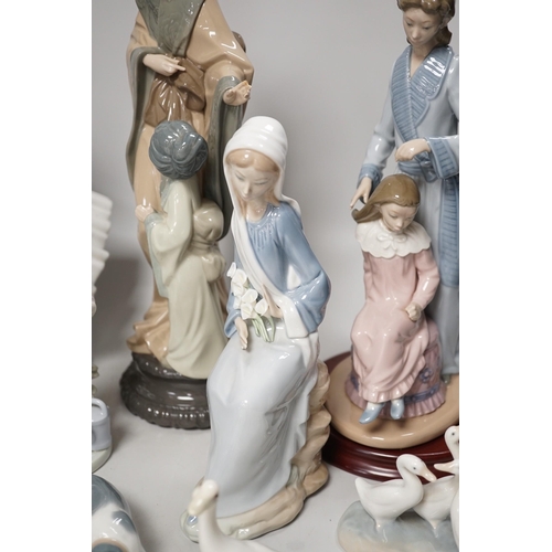 1302 - Seven Lladro and two Nao porcelain figures together with another, stuck to base so mark cant be see... 