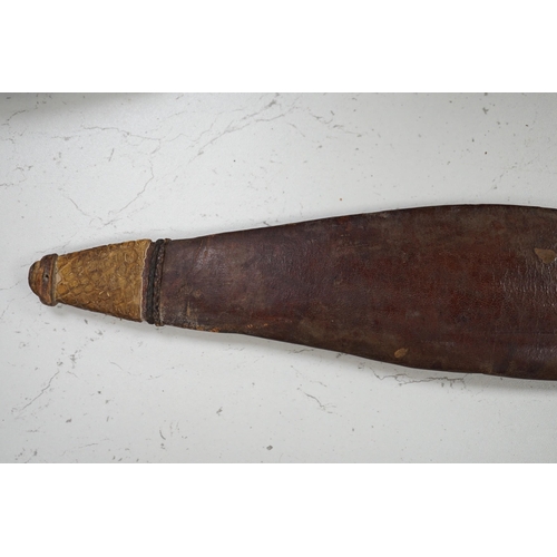 1304 - A Sudanese Kaskara sword with snake skin mounted leather scabbard, total length 79cm