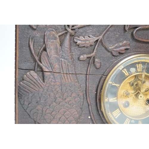 1307 - A late 19th century / early 20th century folk art carved oak cased clock, decorated with hanging dea... 