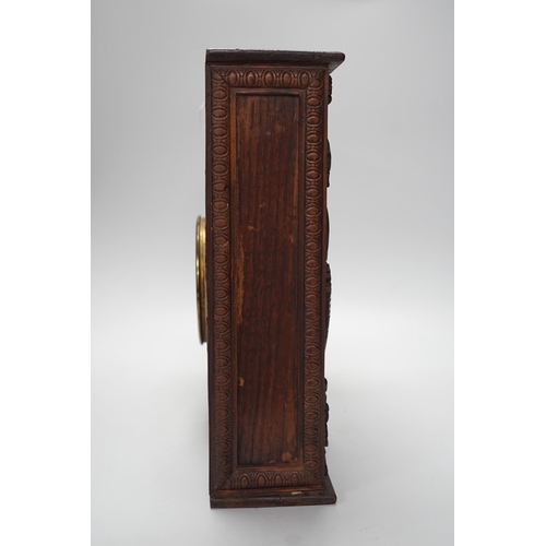 1307 - A late 19th century / early 20th century folk art carved oak cased clock, decorated with hanging dea... 