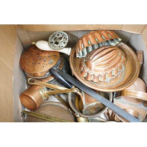 1310 - A quantity of various copper and brass to include jelly moulds, trivets, watering cans etc.