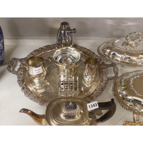 1315 - A large quantity of plated wares including two entree dishes and covers, a three-piece tea set etc.... 