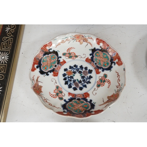 1320 - A group of 19th/20th century Japanese porcelain and pottery dishes. Largest 33cm diameter