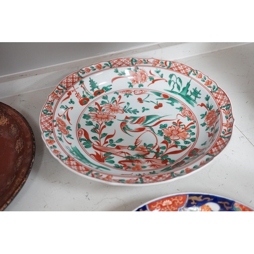 1320 - A group of 19th/20th century Japanese porcelain and pottery dishes. Largest 33cm diameter