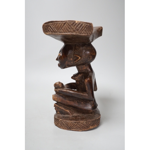 1338 - An African tribal carved wood fertility figure headrest, possibly Songye,. 24cm tall