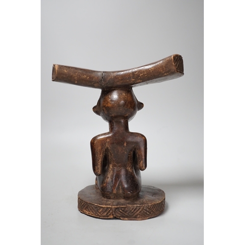 1338 - An African tribal carved wood fertility figure headrest, possibly Songye,. 24cm tall