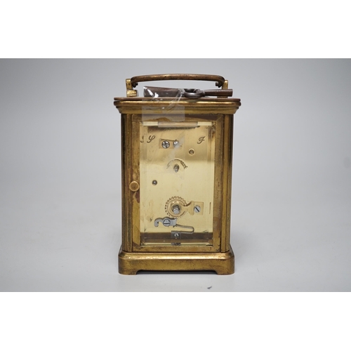 1364 - A 19th century brass carriage timepiece with black Roman numerals and second markers over a white di... 