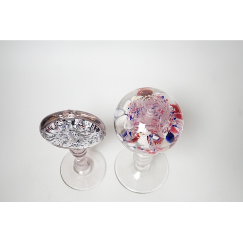 1372 - Two 19th century glass pedestal ornaments, one possibly a wig stand, the other containing a sulphide... 