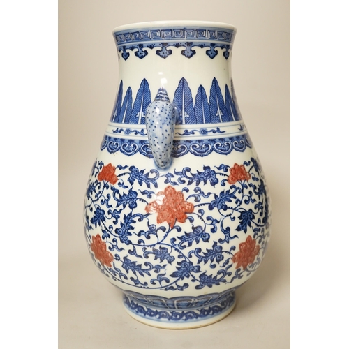 1376 - A Chinese underglaze blue and copper red two-handled vase. 31cm tall