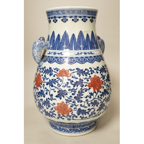 1376 - A Chinese underglaze blue and copper red two-handled vase. 31cm tall