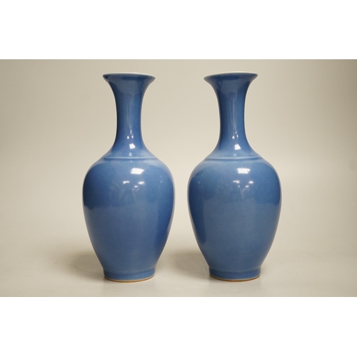 1391 - A pair of Chinese blue glazed vases, 21cm