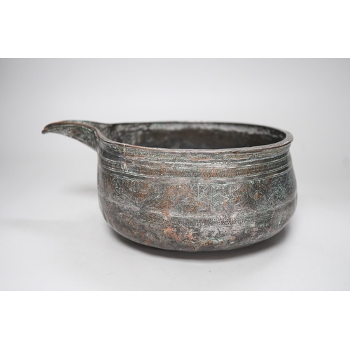 1393 - An early Islamic tinned copper pouring vessel, Egypt or Syria, 26cm long, Kufic inscriptions