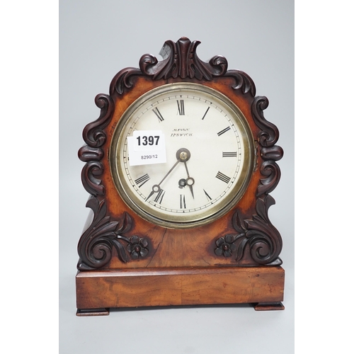 1397 - Mason, Ipswich. A 19th century mahogany cased mantel clock with scrolling moulded decoration - 31cm ... 