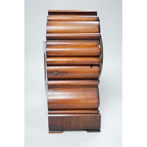 1397 - Mason, Ipswich. A 19th century mahogany cased mantel clock with scrolling moulded decoration - 31cm ... 