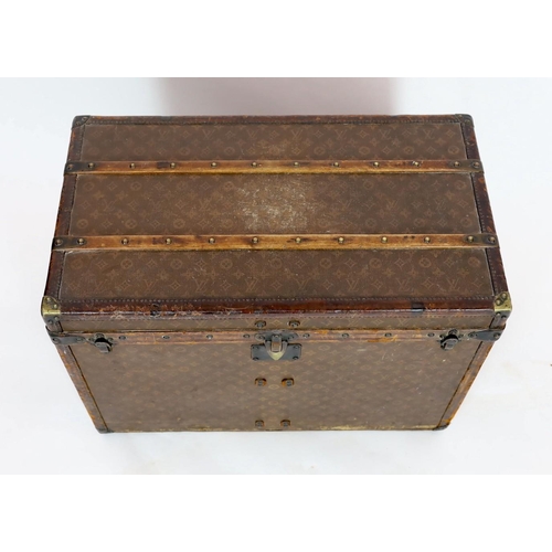 44 - A Louis Vuitton brass mounted leather bound trunk, c.1910, numbered 137426, with LV covering and too... 