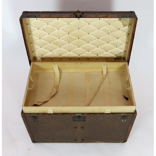 44 - A Louis Vuitton brass mounted leather bound trunk, c.1910, numbered 137426, with LV covering and too... 