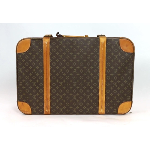 45 - A 1980/90s Louis Vuitton canvas monogram suitcase, with calf leather straps and brass hardware, inte... 