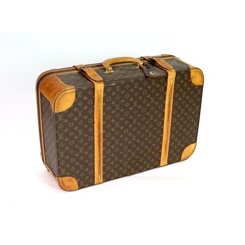 45 - A 1980/90s Louis Vuitton canvas monogram suitcase, with calf leather straps and brass hardware, inte... 