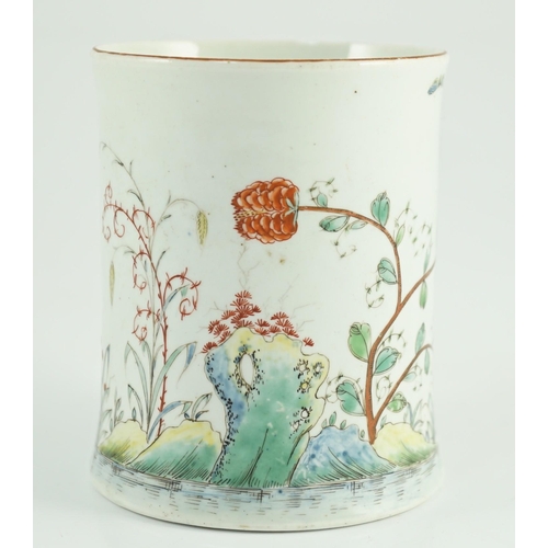 100 - A rare Worcester polychrome 'flower and rockwork' small mug, c.1753-54, painted with rockwork, scrol... 