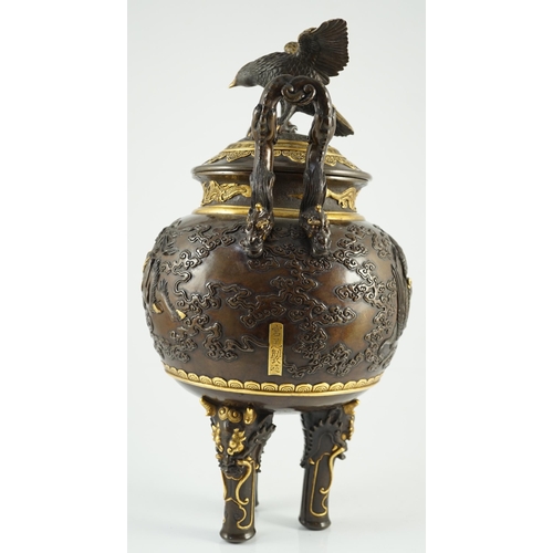 111 - An impressive Japanese brown patinated and gilded bronze tripod koro and cover, by Miyao Eisuke, Mei... 