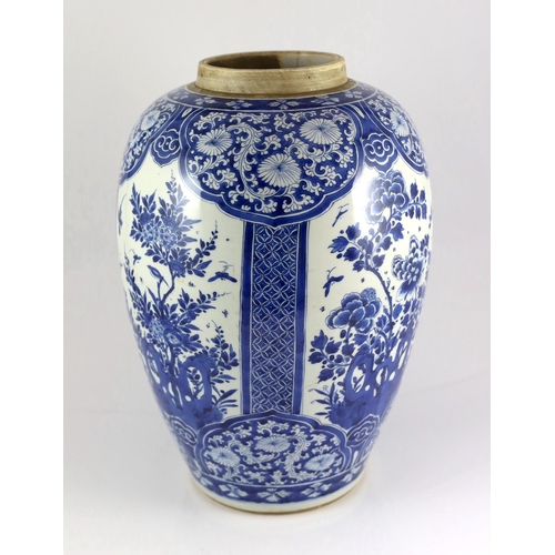 120 - A large Chinese blue and white large ovoid jar, Kangxi period, painted to four reserves with birds a... 