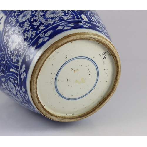 120 - A large Chinese blue and white large ovoid jar, Kangxi period, painted to four reserves with birds a... 